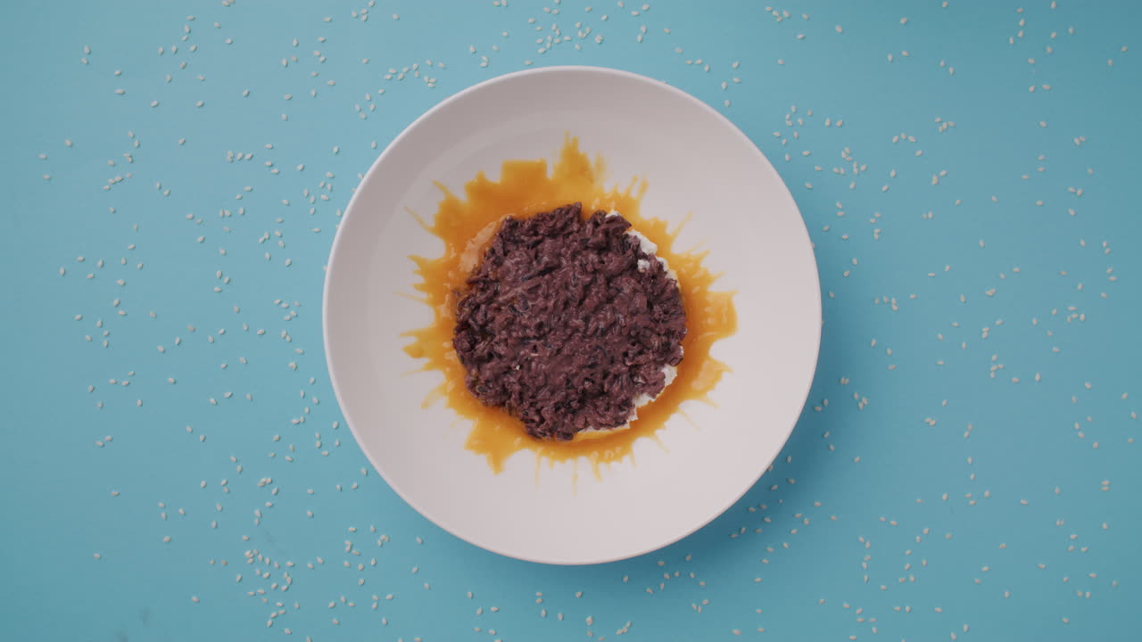 Empty Plate of Sweet Rice Dessert with Orange Sauce