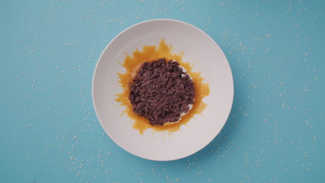 empty plate of sweet rice dessert with orange sauce