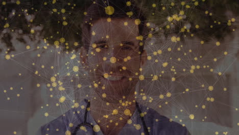 animation of yellow nodes and connections over smiling healthcare professional outdoors