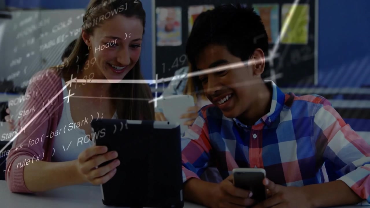 Student pair tapping tablet and glancing phone, starting charts and code overlay aiding education