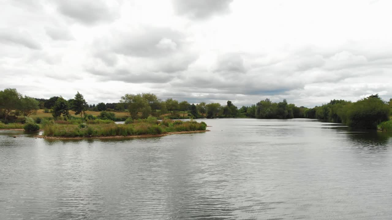 Slow paning aerial drone shot over the Ely great ouse river during a cloudy day