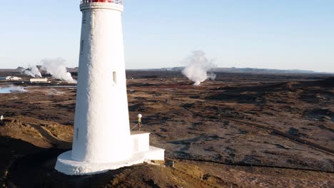 gunnuhver geothermal park in iceland with reykjanesviti passing in front