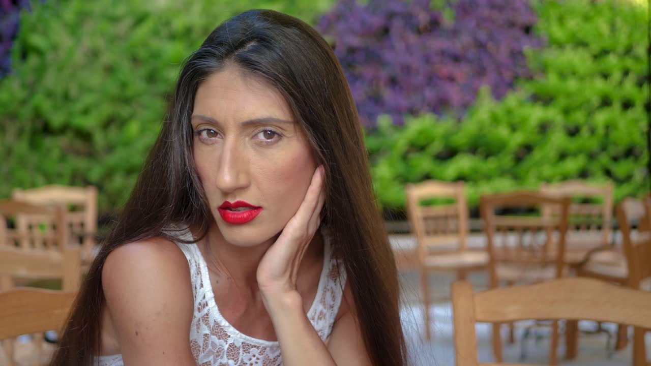 Portrait of Sexy Female Model With Long Dark Hair Looking and Smiling at Camera, Full Frame Close Up