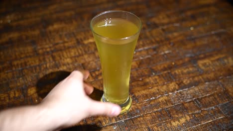 a glass of beer on a table