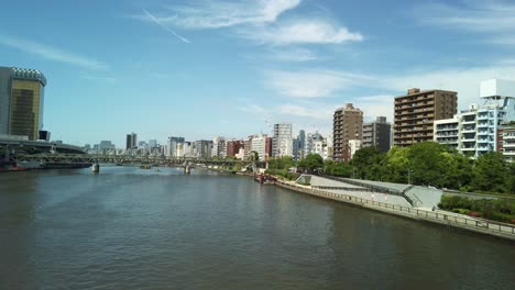 City-view-from-Kototoi-Bridge-in-Tokyo,-crossing-the-Sumdia-river,-with-buildings-of-Hanakawado