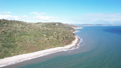 aerial view of the jurassic coast of lyme regis and seaton undercliffs, with its beautiful cliffs and beach meeting the english channel