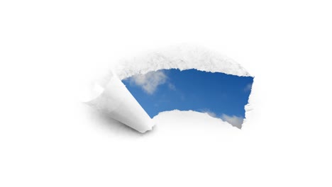 creative 4k time laps video of fast moving clouds in the blue sky that are visible through a hole with torn edges in white paper. the concept of opportunities, a happy future.