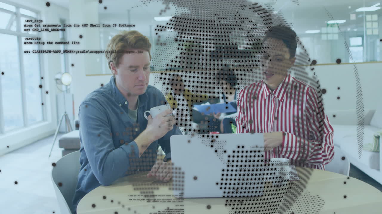 Working with laptop, two people viewing animation of digital world map and code