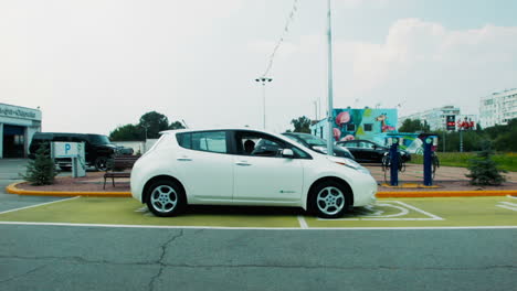 electric car charging at parking lot