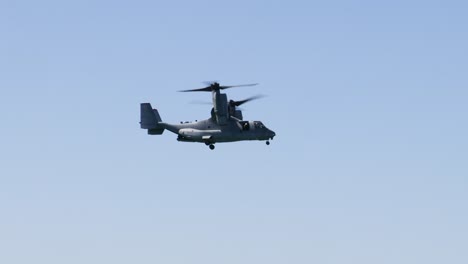 osprey helicopter performing flight operations against blue sky