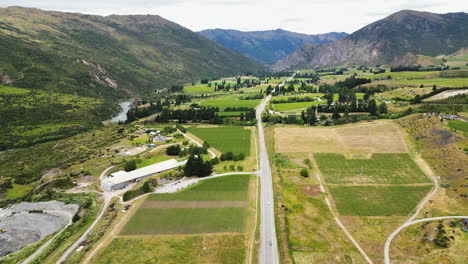 wine fields surrounded by mountain landscape in otago, new zealand