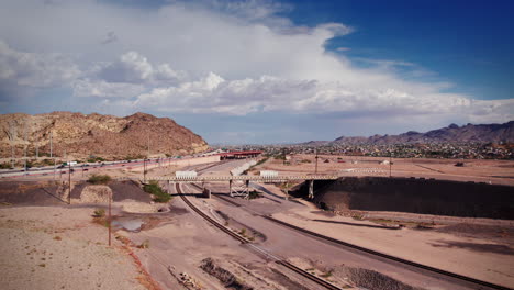 Ascending-over-the-highway-between-El-Paso,-Texas-and-Juarez,-Mexico