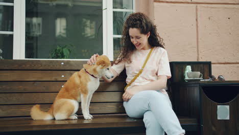 woman and dog at a cafe