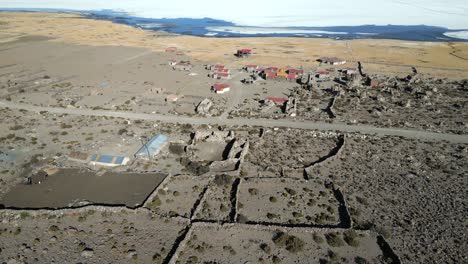 aerial of eco lodge in the deserted landscape of salar de uyuni close to the shore of uyuni salt lake, bolivia