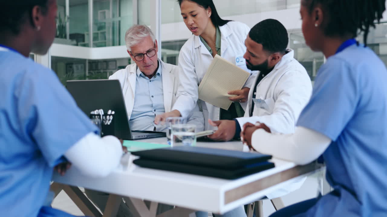 Staff, meeting and doctors with a laptop