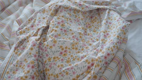 close-up of a floral bedding with pink and yellow flowers