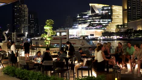 people socializing on a rooftop at night