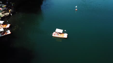 view of a small boat at monticchio's lakes from a drone