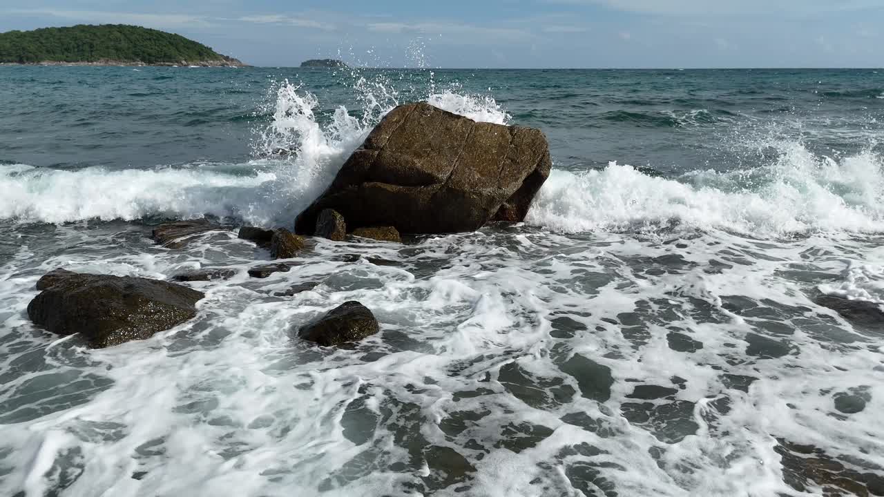 Waves crashing on rocks at the coast