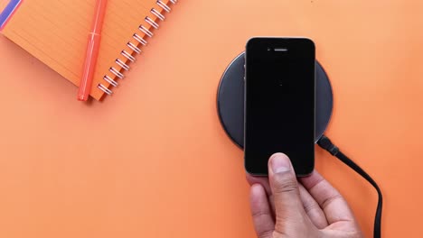wireless charging pad with smartphone and notebook