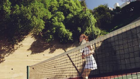 woman playing tennis on a sunny day