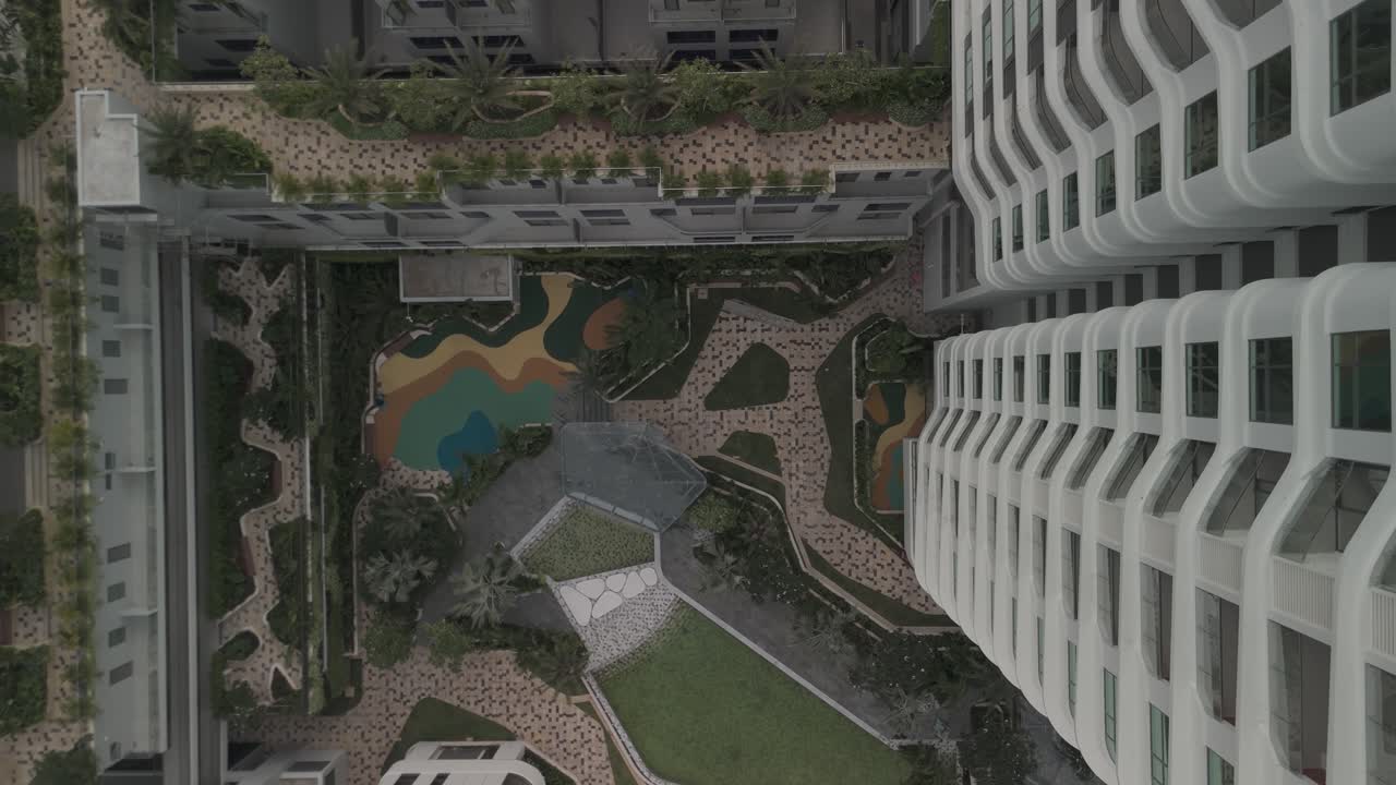 Modern architecture top down aerial view with landscaping, gardens, swimming pool and building elements in residential development