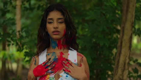 amid the lush scenery of a tropical park, a young girl proudly displayed body paint