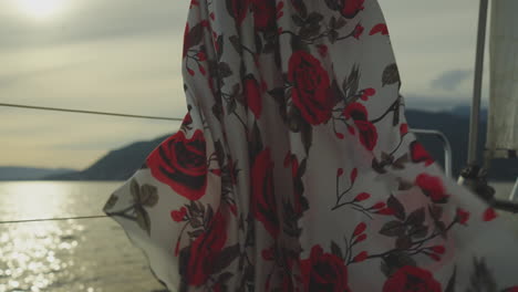 woman in a floral dress by the sea