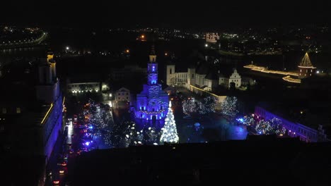 Drone-aerial-view-of-Christmas-tree-in-Kaunas,-Lithuania