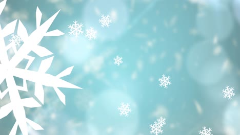 Animation-of-snowflakes-falling-on-blue-background