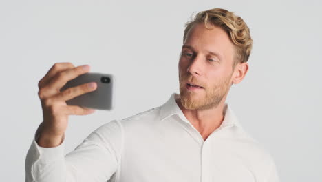 Young-businessman-taking-picture-of-himself