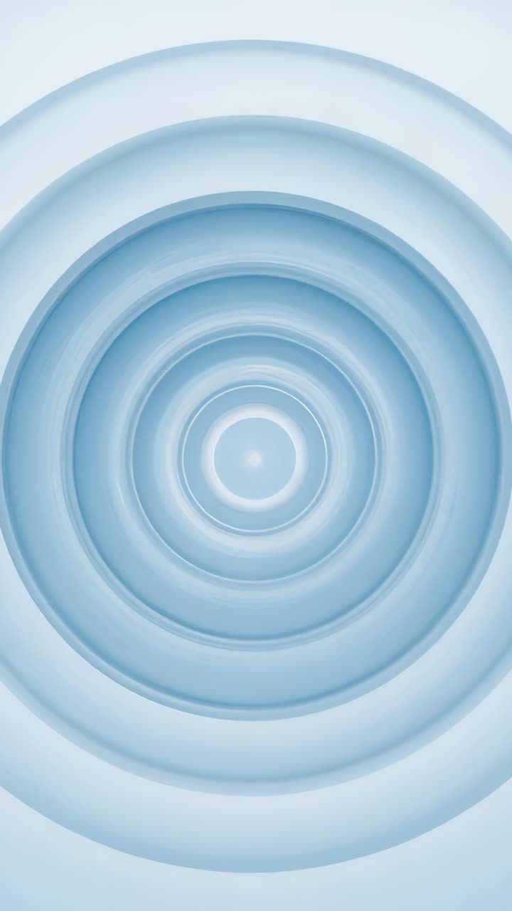 Vertical video: Starting frames showing concentric rings pulsing on pale blue field, central dot