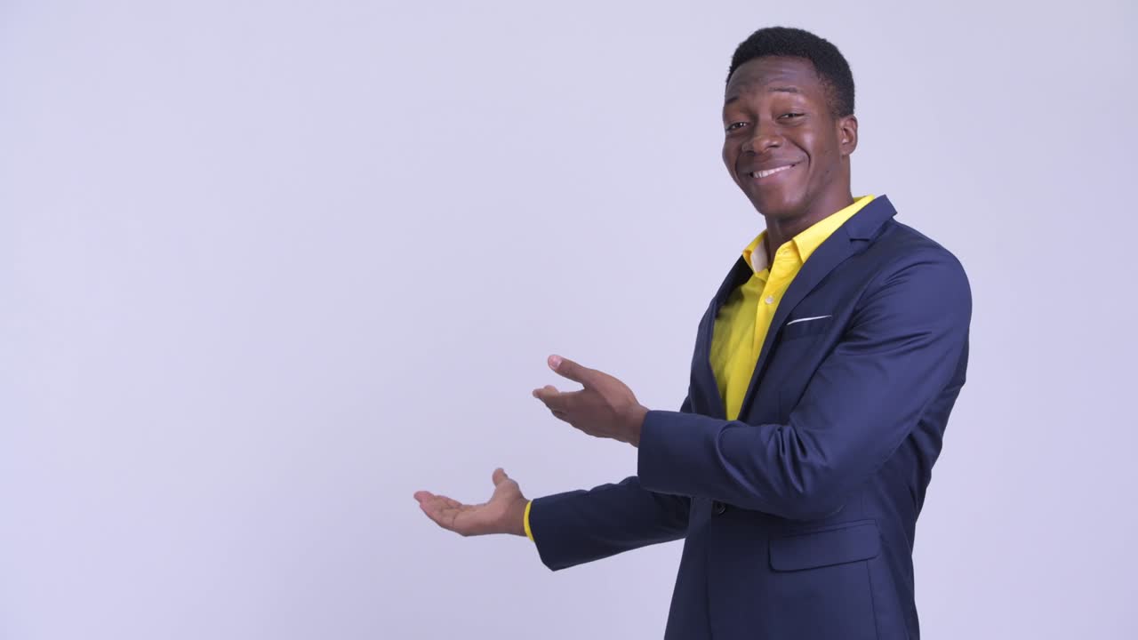 Young handsome African businessman in suit