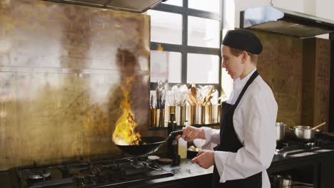 Chef-cooking-vegetables-with-fire