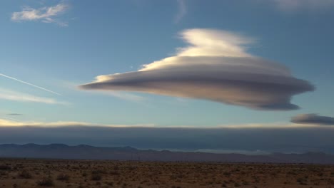 A-rare,-altocumulus-lenticularis,-cloud-formation-over-the-Mojave-Desert---aerial-view