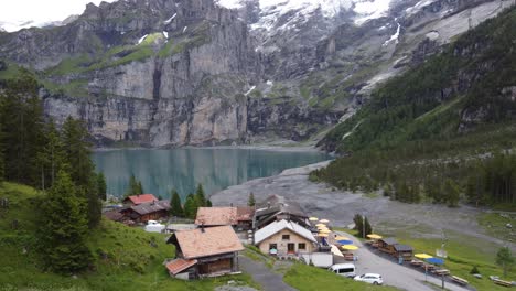 mountain hotel restaurant at alpine oeschinen lake amid swiss alps in kandersteg, switzerland