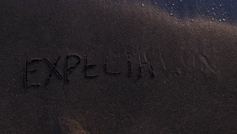 the word 'expect' written in sand being washed away by ocean waves
