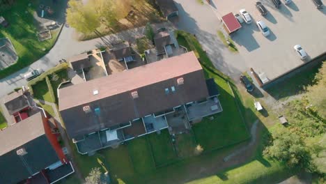 looking down over suburbia, soccerfield, houses and parking