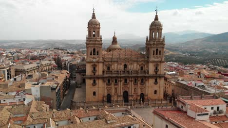 Spain-Jaen-Cathedral,-Catedral-de-Jaen,-flying-shoots-of-this-old-church-with-a-drone-at-4k-24fps-using-a-ND-filter-also-it-can-be-seen-the-old-town-of-Jaen