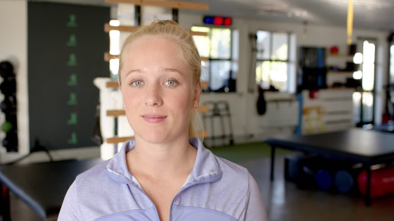 Smiling woman in rehabilitation center, focusing on disability recovery and wellness