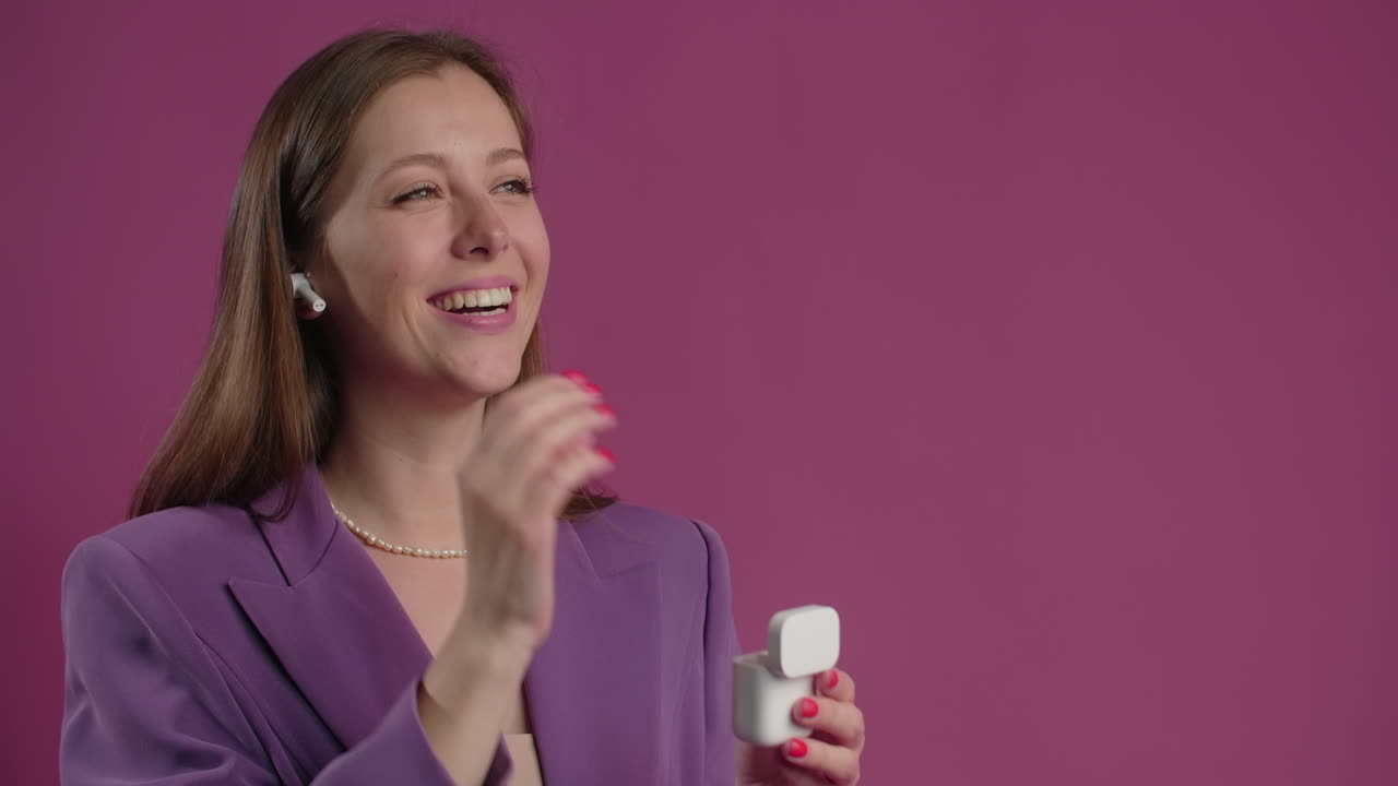 Woman in Purple Blazer with Earbuds