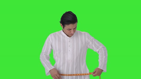 Indian-man-getting-sad-after-measuring-waist-Green-screen