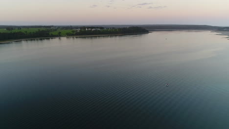 Aerial-shot-of-lonely-boat-on-water