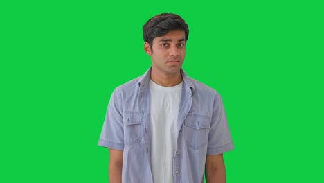 young indian boy trying to ignore someone green screen