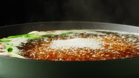 boiling broth in a pan