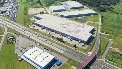 aerial top view of the large logistics park with warehouse, loading hub with many semi-trailers trucks