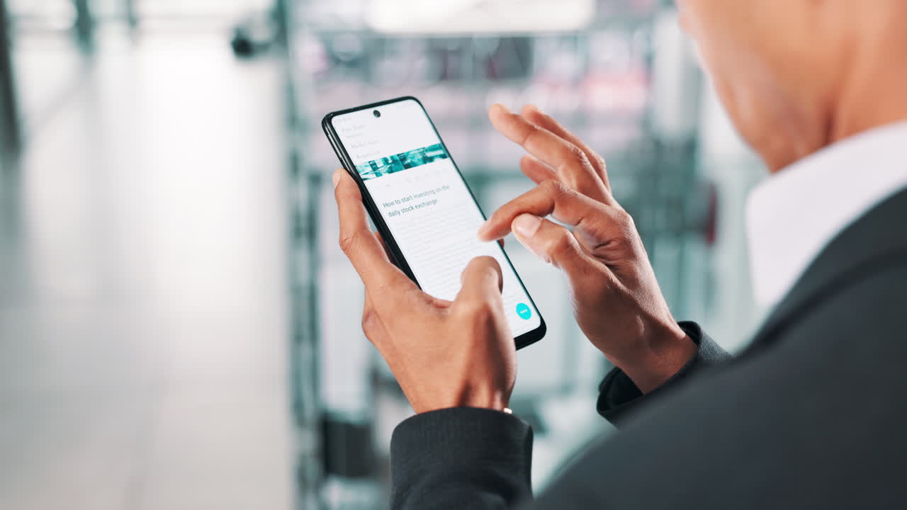 Man reading investment advice on smartphone