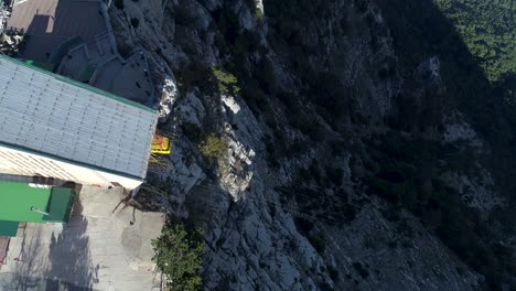 cable car on a mountain cliffside