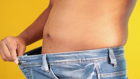 men put jeans and showing weight loss ,