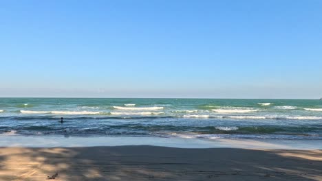 calm waves rolling onto a sandy beach